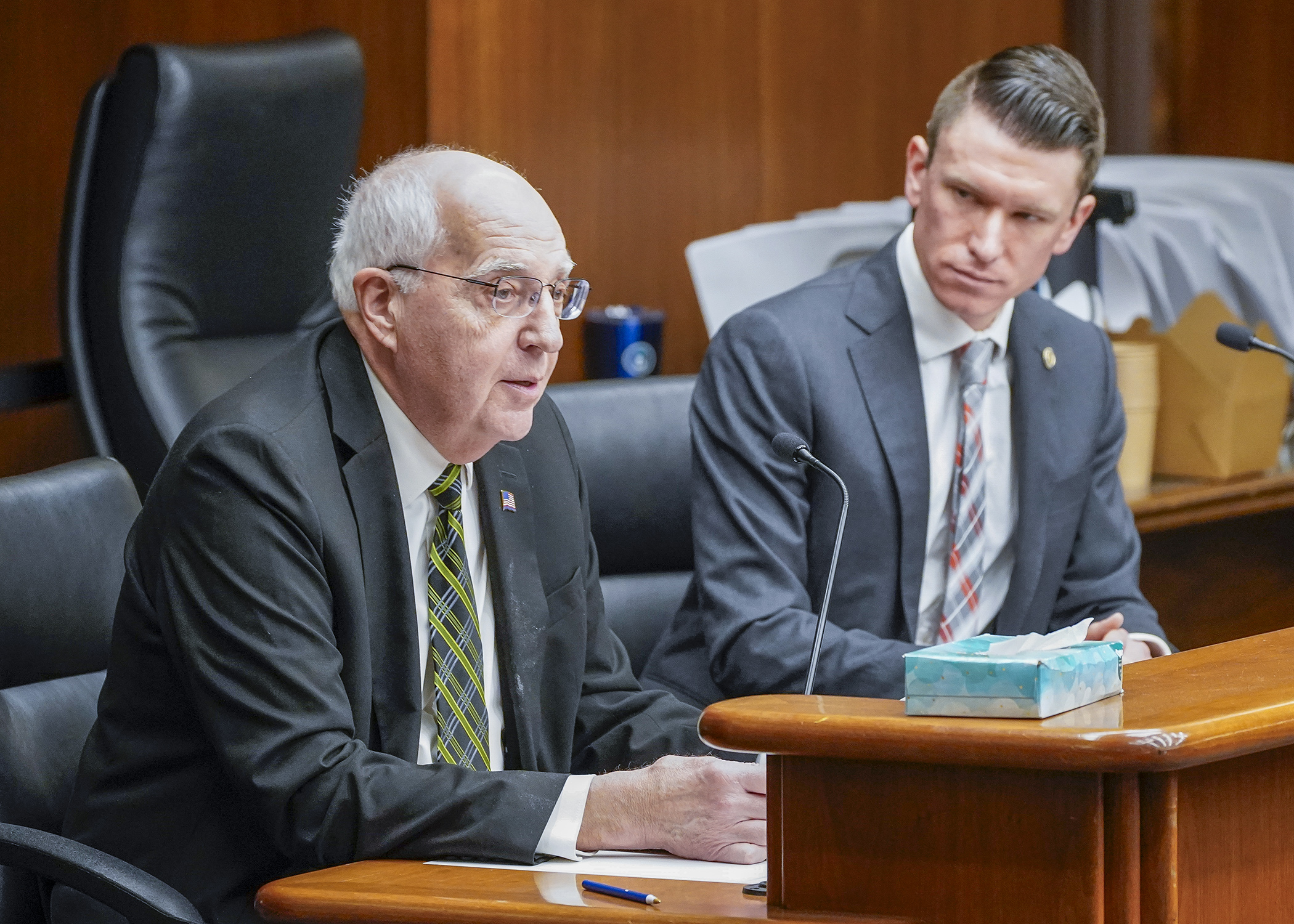 Former Dakota County Attorney Jim Backstrom testifies before the public safety committee March 15 in support of a bill sponsored by Rep. Matt Norris, right, that would establish an Office of Animal Protection. (Photo by Andrew VonBank)